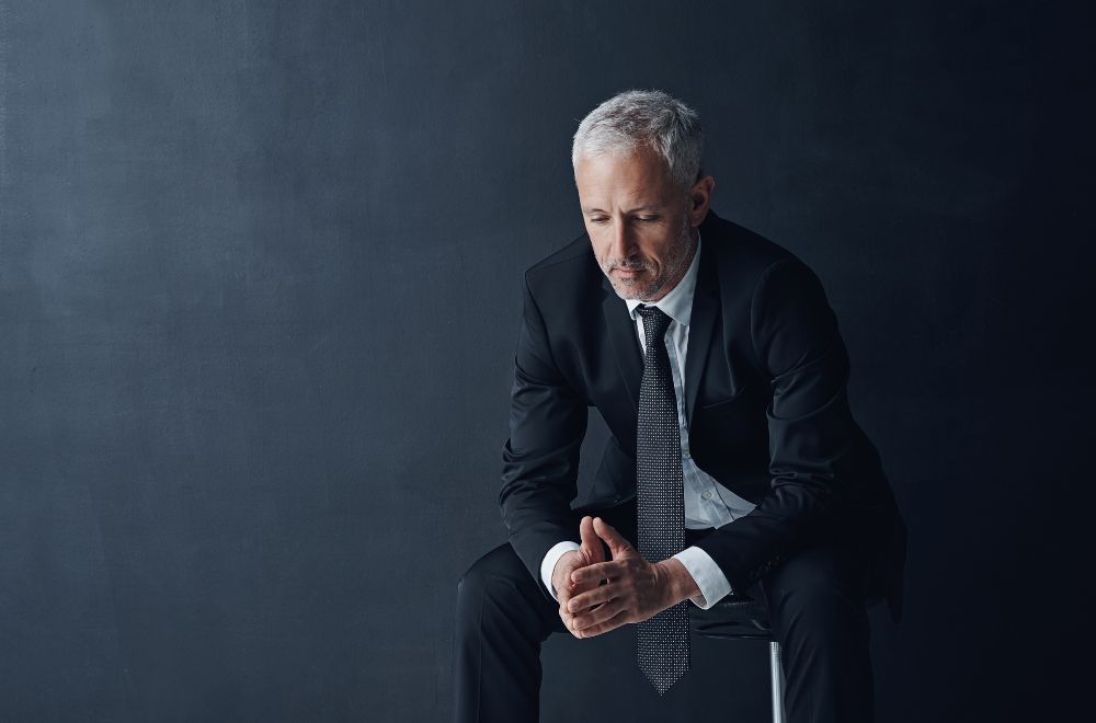Business Man Looking Regretful 