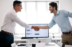 Two Business Co-Founders Shaking Hands