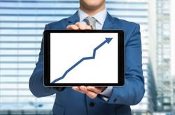 Man Holding Tablet With Graph