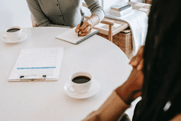 Stock Photo Woman Writing At Desk