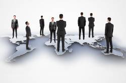 Business Men Standing On Map