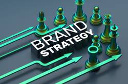 Green Chess Pieces With "Brand Strategy" Written Between Them
