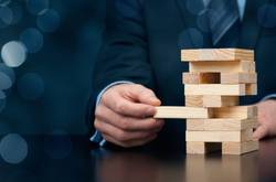 Businessman Using Tetris  As Business Example