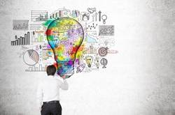 Student With Lightbulb Of Business Ideas