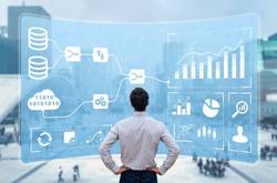 Man Looking At Business Metrics