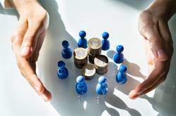 Hands, Coins And Models On White Desk.