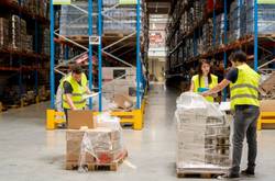 People Working In Industrial Warehouse